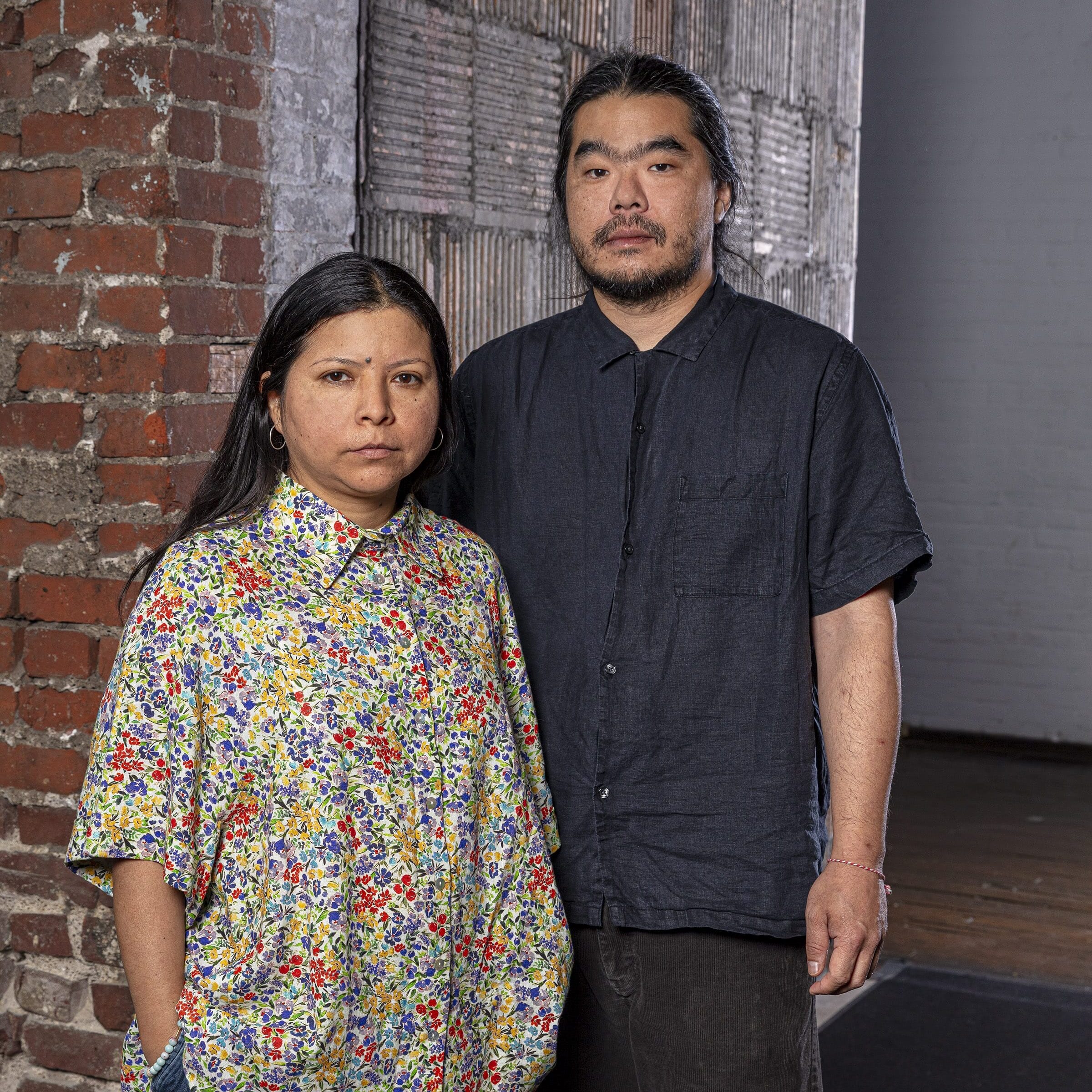 Contemporary Installation Artists Claudia Martinez Garay and Arturo Kameya pose for a portrait.